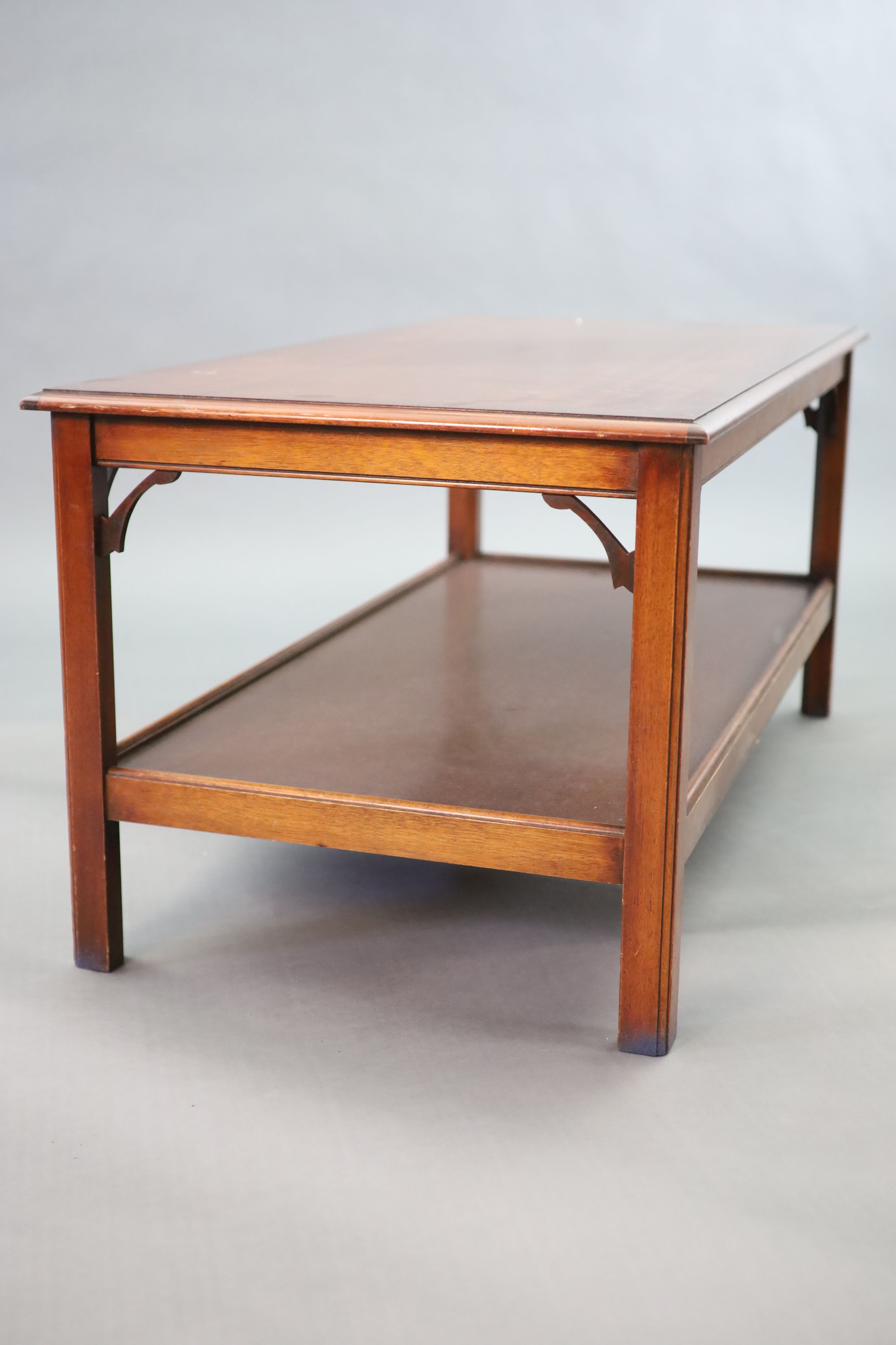 A mahogany two tier coffee table, 122 x 62cm width 122cm depth 62cm height 56cm